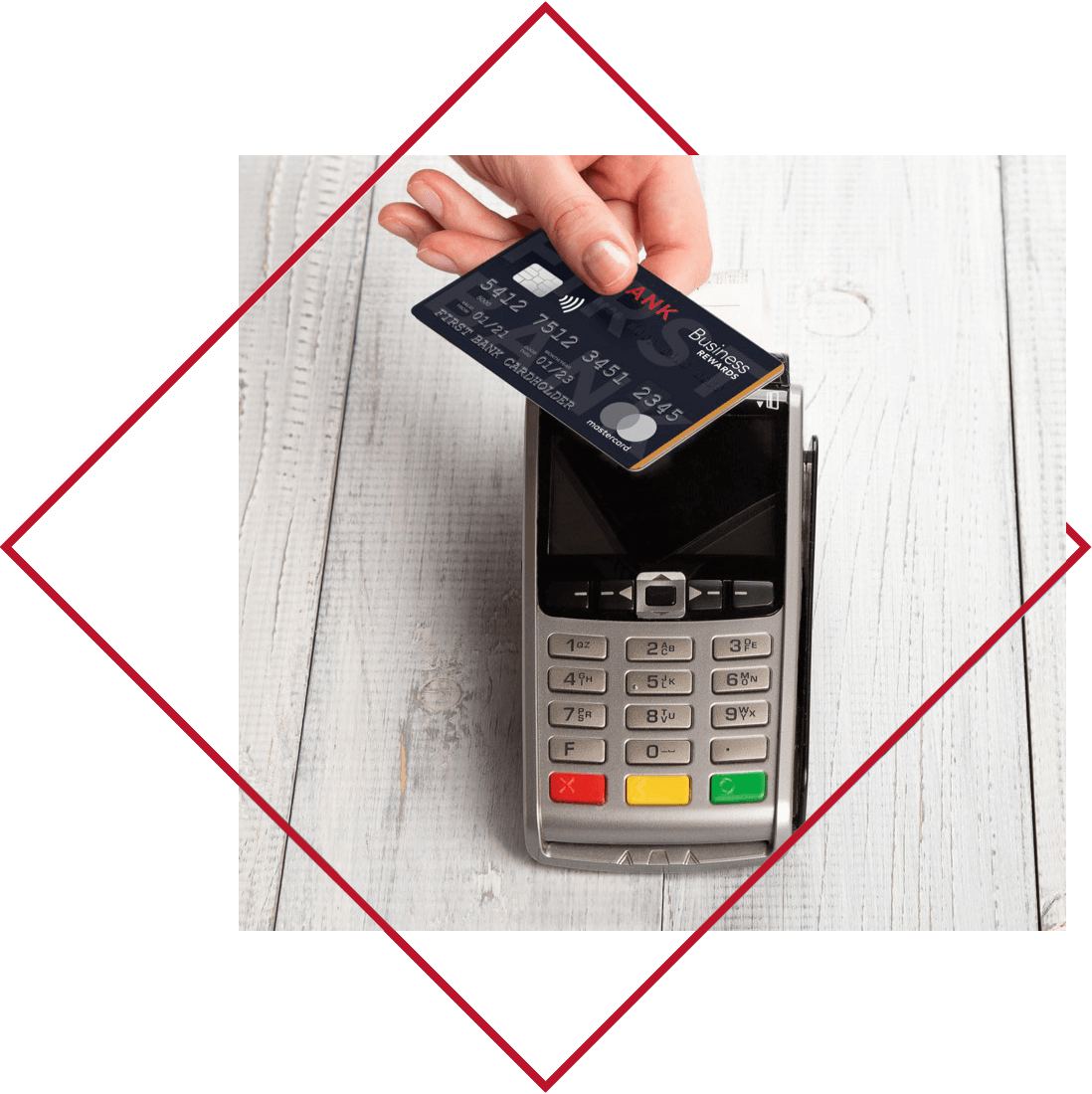 Crawfield Credit Union Credit Card with Rewards being used on touchless payment pad.